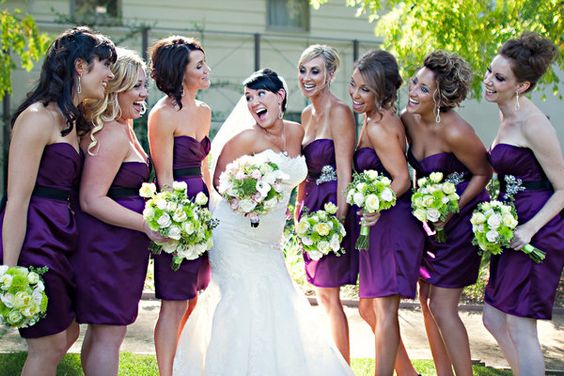 dark purple bridesmaid dresses and a white wedding gown for purple wedding colors combos for 2025 dark purple and bright green