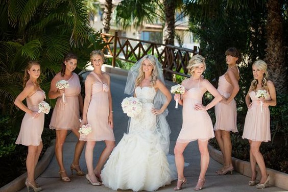 pink bridesmaid dresses and a white bridal gown for july wedding colors combos for 2025 pink and cream