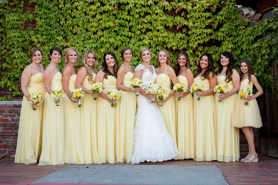 pastel yellow bridesmaid dresses and a white wedding gown for summer wedding colors combos for 2025 pastel yellow and yellow