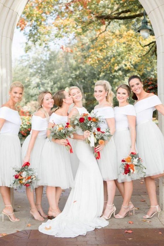 white bridesmaid dresses and a white wedding gown for summer wedding colors combos for 2025 red light pink and white