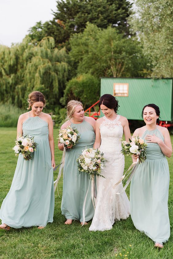 sage green bridesmaid dresses white bridal gown for spring wedding color schemes 2025 sage green peach and pastel yellow