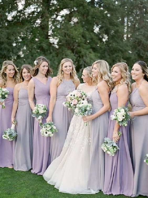 different shades of lavender bridesmaid dresses white bridal gown for spring wedding color schemes 2025 lavender and peach