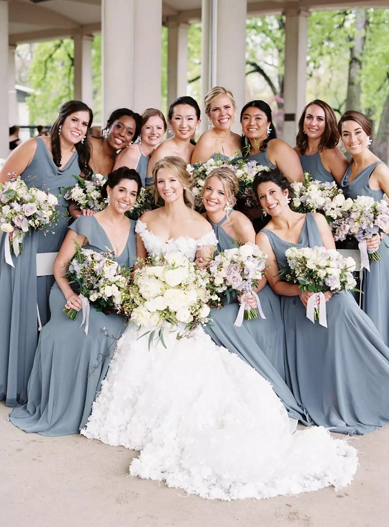 dusty blue bridesmaid dresses white bridal gown for spring wedding color schemes 2025 dusty blue lavender and orchid