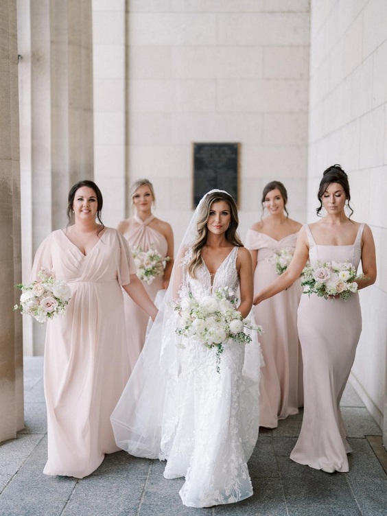 pale pink bridesmaid dresses white bridal gown for spring wedding color schemes 2025 pale pink white and greenery