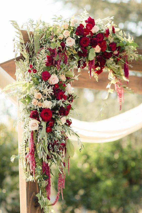 wedding arch with brurgundy and pink flowers for october wedding colors ideas for 2025 burgundy and pink