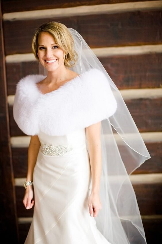 White Bridal Gown and White Fur Wrap for Neutral December Wedding