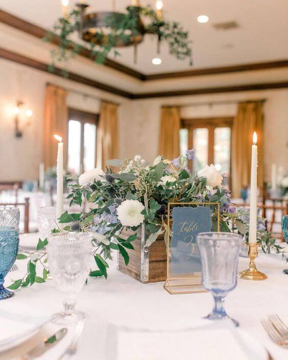 Wedding table decorations for dusty blue March wedding