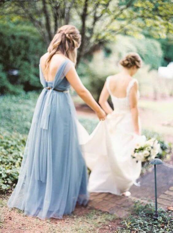 White Bride and dusty blue bridesmaids for dusty blue March wedding