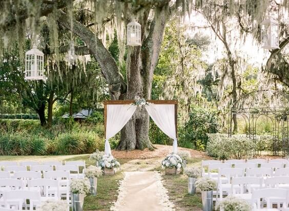 arch and chairs for fall light blue ivory and pastel pink wedding