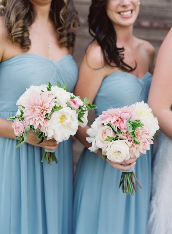 bridesmaids with bouquets for fall light blue ivory and pastel pink wedding