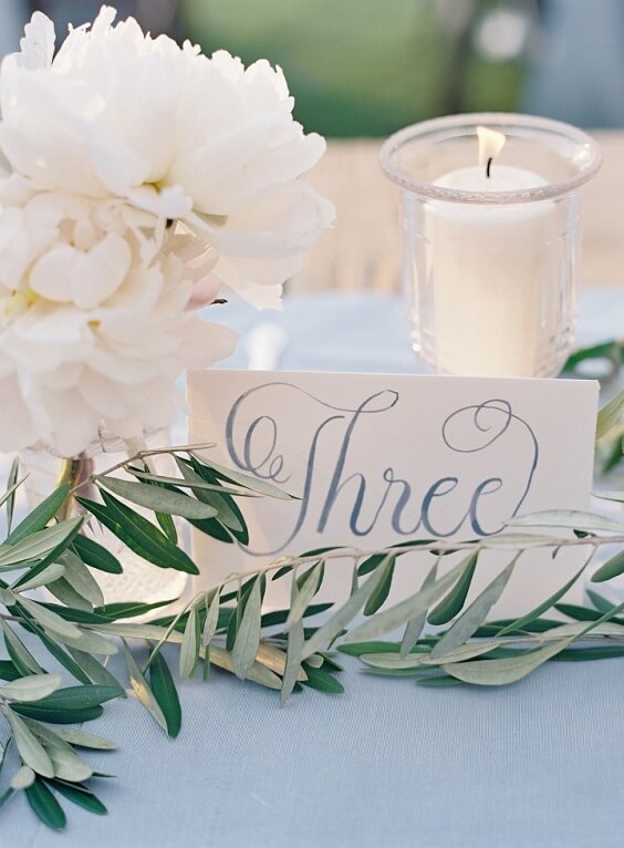 table card and candles for fall light blue ivory and pastel pink wedding