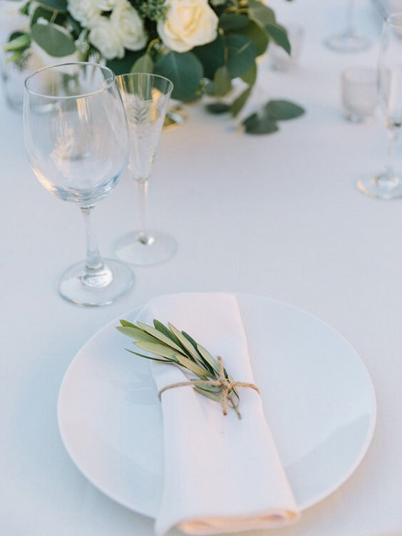 cream tablecloth and white plate setting for spring ice blue wedding