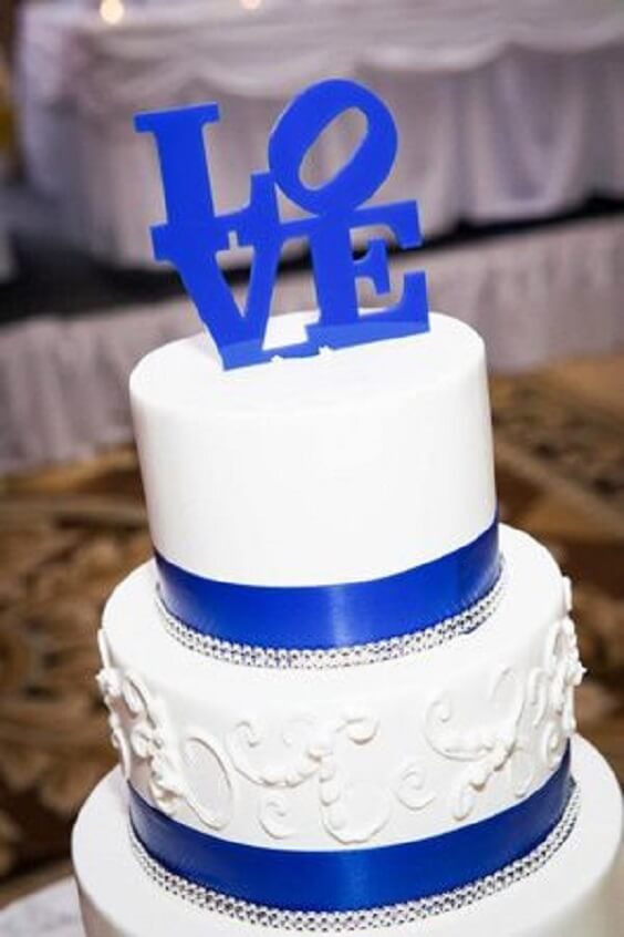 white wedding cake with royal blue ribbon for summer royal blue wedding