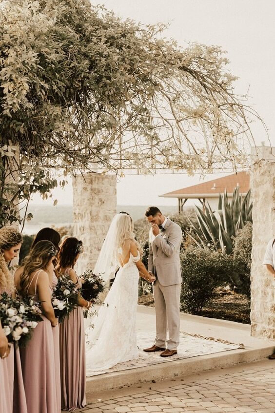 the outdoor wedding ceremony for fall boho chic dusty rose wedding