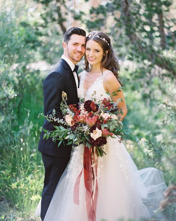 bride and groom for fall burgundy wedding