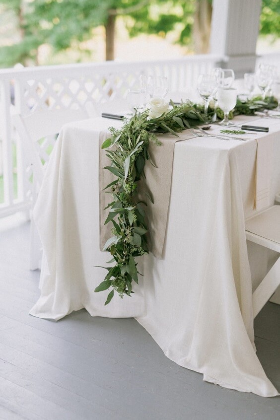 white table runner with greenery for spring dusty blue wedding