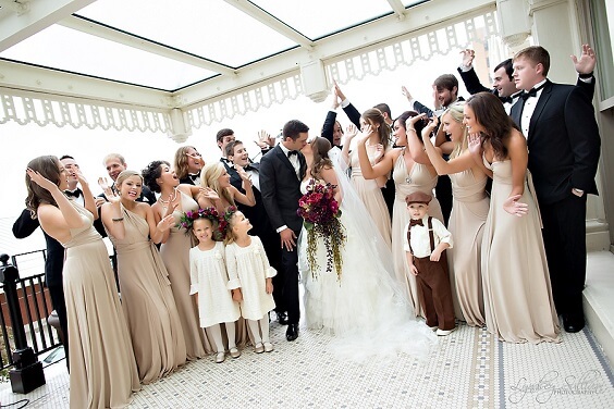 flower girls, bridesmaids and groomsmen for fall champagne and burgundy wedding