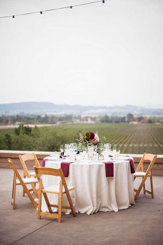 table and chairs for fall champagne and burgundy wedding