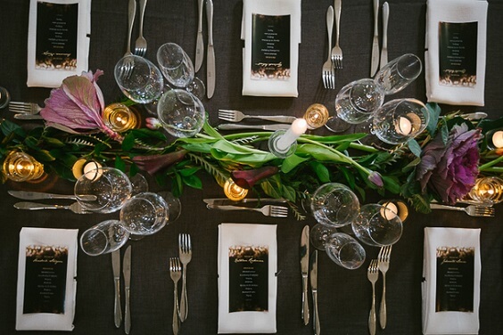 black tablecloth and white napkin for winter green wedding