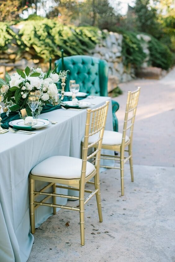 gold chairs for winter green wedding