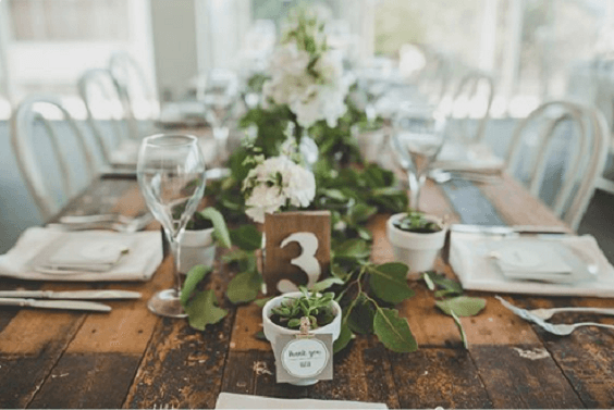 wedding wooden table and number sign for winter green wedding