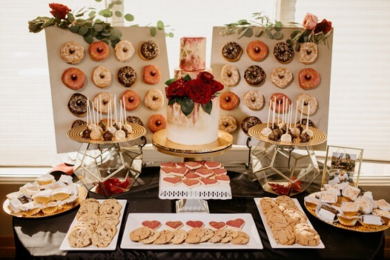 wedding dessert table for champagne and burgundy wedding bridesmaid dresses bouquets and cakes